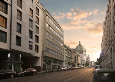 Rue des Palais à Schaerbeek au coucher du soleil, avec le dôme de l'église royale Sainte-Marie en fond